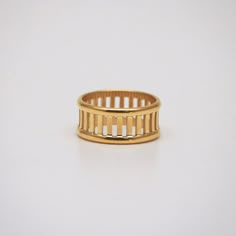 This highly polished gold band ring has a classic and simple look with multiple bars attaching two outer rails. 18k gold plated Stainless steel base Waterproof and tarnish free Available in US size 6-8 Ring sizing chart Man Jewelry, Hollow Ring, Dainty Rings, Rope Rings, Reunion Island, Bar Ring, Open Bar, Gold Band Ring, Cz Ring