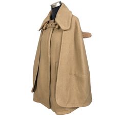 Chloé 1N1 Camel cape coat in beige colour. Button up wool cape with large collar. Still in good condition. SEE THE PICTURES FOR MORE DETAILS. CONDITION : 9/10 MEASUREMENT Pit : 22 inch Length : 32 inch Shoulder : 16 inch Sleeve : 27 inch Size On Tag : 34 Recommended Size : 34 PAYMENT We accept PayPal only. The item will be ship 3-5 days once the payment has been made. NORMAL SHIPPING FEDEX USUALLY AROUND 7-21 DAYS BEFORE REACH THE DESTINATION. EXPRESS SHIPPING  DHL USUALLY AROUND 5-7 DAYS BEFORE REACH THE DESTINATION. *NOTES TO BUYERS* PLEASE DO NOT RELY ON THE SIZE OF THE TAG, SOME OF THE SIZE MAYBE DIFFERENT FOR DIFFERENT CONTINENTS. IT IS REALLY IMPORTANT TO FOLLOW THE MEASUREMENT. NO REFUND IF YOU PURCHASED ANY ITEM WITHOUT USING THE MEASUREMENT GIVEN.  MOST OF MY ITEMS ARE USED ITEMS/ Beige Wool Cape Outerwear, Beige Cape For Winter Workwear, Beige Wool Cape For Fall, Elegant Beige Wool Cape, Elegant Beige Cape Poncho, Classic Wool Cape For Winter, Cream Cape Outerwear For Fall, Cream Cape For Fall, Mantel Cape