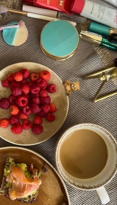 there are two plates with food on them and one has raspberries in it