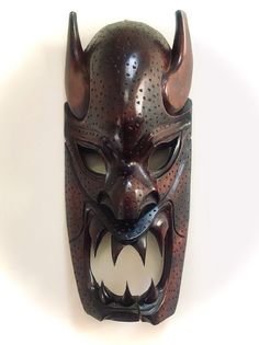 Philipino Bukanawa Dragon Hand Carved Wood Tribe Tribal Huge Devil Mask Vintage 1980   The Bukanawa Dragon Mask is a truly unique piece of art. Carved from wood, this tribal mask is a perfect wedding gift or home warming gift. The large size and intricate details make it a statement piece for any eclectic home decor. The mask was hand carved in the 1980's and is a true one-of-a-kind. Year circa 1980 Artist: Unknown Title: Philippines Dragon (Bakunawa) Mask Medium: Hand-Carved Wood Mask Size: 22. Dragon Hand, Devil Mask, Dragon Mask, Wood Mask, Art Carved, Perfect Wedding Gift, Eclectic Home, Hand Carved Wood, Carved Wood