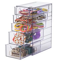 an acrylic display case holds many pairs of shoes and purses