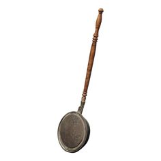 an old metal pan with a wooden handle on a white background is seen in this image