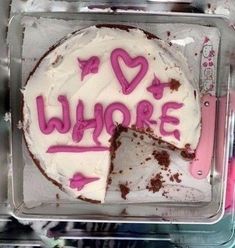 a white cake with pink writing on it