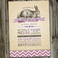 an easter bunny and egg hunt is shown on a piece of wood with purple ribbon