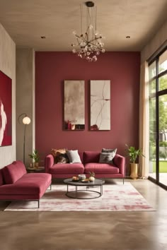 a living room filled with furniture and a painting on the wall above it's windows