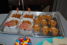 there are some snacks on the table ready to be eaten at this birthday party or baby shower