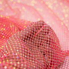 pink and gold sequins are covering the fabric