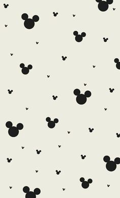 black and white mickey mouse wallpaper with small dots on the bottom half of it