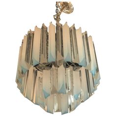 an art deco chandelier hanging from a chain