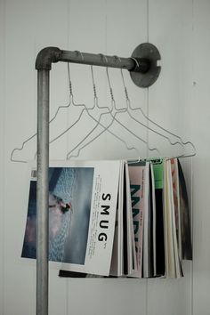 a magazine rack with magazines hanging from it