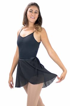 This beautiful and simple wrap skirt is made with a fabulous layer of georgette fabric. The skirt drapes over the body delicately and has a matte finish. A great ballet basic cover-up piece. Adult Short Sleeve Leotard is shown in the picture. Style: BM2088Fabric: Polyester Sizes: S/M, L/XL Center Back Length: S/M = 17", L/XL = 18 3/4" Colors: BlackActual color may vary slightly from your monitor. For wholesale inquiries, please call us at (626) 336-2111 or email us! Fitted Chiffon Skirt For Dance, Elegant Short Flowy Skirt, Elegant Fitted Skort With Gathered Skirt, Elegant Lined Skirt For Dance, Fitted Chiffon Skirt For Formal Occasions, Black Flowy Wrap Skirt For Evening, Elegant Flowy Mini Skirt, Elegant Wrap Flowy Skirt, Formal Fitted Chiffon Skirt