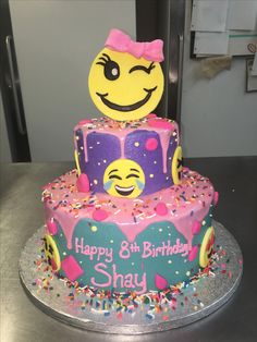 a smiley face birthday cake with sprinkles