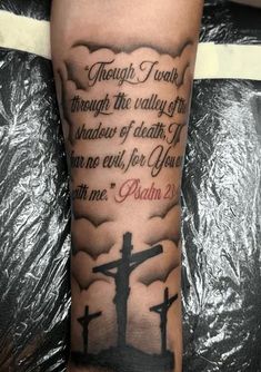 a person with a cross on their arm that says, though i walk through the valley of shadow