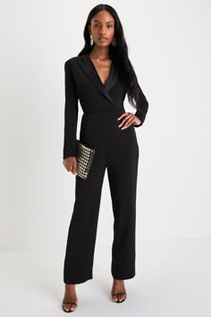 You'll stun the Lulus Impressive Presence Black Collared Straight Leg Jumpsuit! Lightweight flat woven fabric shapes long fitted sleeves that frame a darted bodice with a collared neckline and peaked satin lapels. Wrap-inspired design features a slender strap and a gunmetal-toned horsebit clasp at the fitted waist. Front diagonal pockets accent straight legs as they fall to ankle-length hems. Hidden zipper/clasp at back. Fit: This garment fits true to size. Length: Ankle length. Size medium meas Women’s Suits Black, Woman Officiant Outfit, Elegant Long Sleeve Pantsuit For Formal Occasions, Sleek Long Sleeve Pantsuit For Semi-formal Occasions, Sleek Long Sleeve Semi-formal Pantsuit, Elegant Jumpsuits And Rompers For Evening In Fall, Elegant Evening Jumpsuits And Rompers For Fall, Tailored Long Sleeve Evening Pantsuit, Tailored Long Sleeve Pantsuit For Formal Occasions