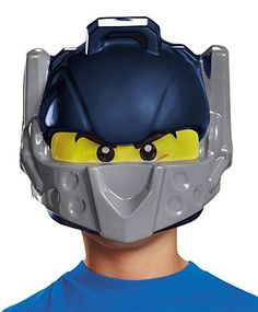 a man in a blue shirt wearing a gray helmet with yellow eyes and an angry look on his face