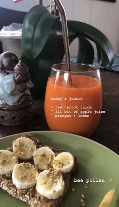 there is a piece of toast with bananas on it and an orange juice in the background