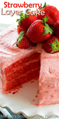 a strawberry layer cake with strawberries on top