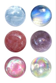 four different colored marbles are shown on a white background