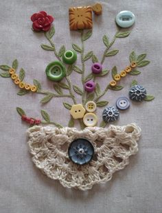 there is a crocheted bag with buttons on it