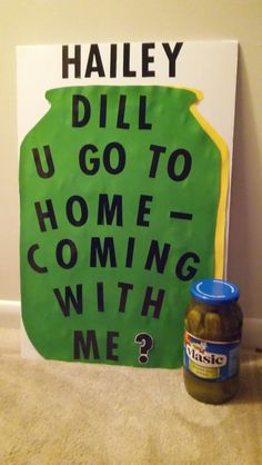 a sign that says dill u go to home coming with me? next to a jar of pickles