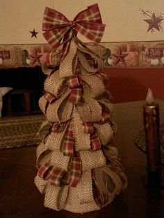 a christmas tree made out of burlocks on a table