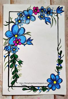 a paper with blue flowers and green leaves on it