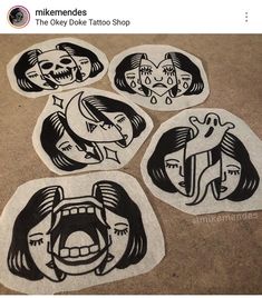 four stickers with cartoon faces on them