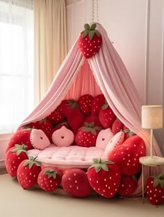 a bed made out of strawberries in the shape of a tent with pink curtains