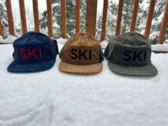 This hat is easily one of our favorites and most popular.  Navy blue corduroy hat with red SKI embroidery, Tan corduroy hat with black SKI or army green corduroy hat with black SKI embroidery.  Corduroy comes in varying thicknesses, which are determined by the width of each individual cord, also known as a wale. (Wale is a very old word deriving from the word for the raised ridges in a plowed field) Product Info Fabric: 100% Cotton Shape/ Profile: Unstructured Mid Profile Closure: Snapback Bill Shape: Sweatband Material: Cotton Sweatband Fit/ Size: OSFM 58cm Winter Snapback Hat For Outdoor Activities, Winter Flat Bill Hats For Outdoor Activities, Winter Hats For Outdoor Activities With Flat Bill, Winter 5-panel Snapback Hat For Outdoor, Winter Outdoor 5-panel Snapback Hat, Winter Outdoor Snapback Hat With Flat Bill, Adjustable Trucker Hat For Winter Outdoor Activities, Winter Outdoor Trucker Hat With Flat Bill, Winter Outdoor Trucker Hat With Flat Brim