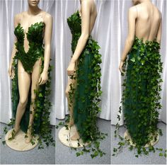 the mannequin is covered in green ivy