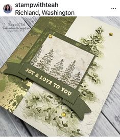 a close up of a card with trees on it