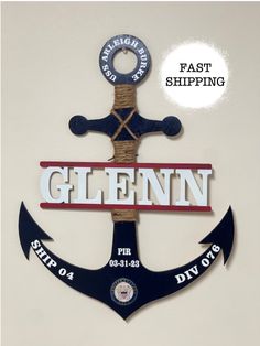 an anchor with the words glennn on it and a rope hanging from it's side