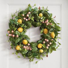 a wreath with lemons and green leaves