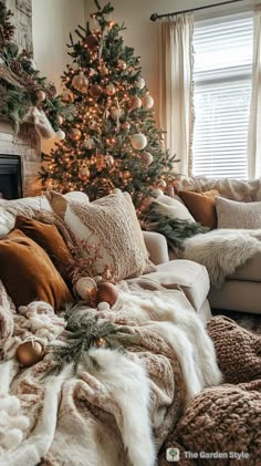 a living room filled with furniture and a christmas tree