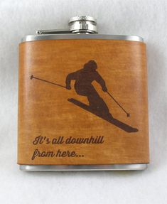 a wooden flask with an image of a skier on it