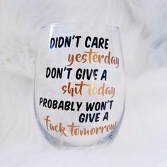 a wine glass with words written on it