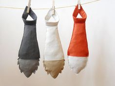 three towels hanging on a clothes line with one being folded