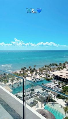 an ocean view from the balcony of a hotel in miami, with two birds flying overhead