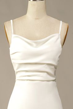 the back of a white dress on a mannequin