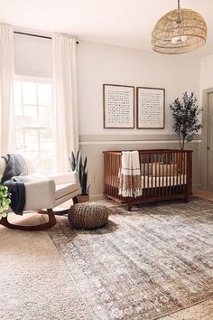 a baby's room with a crib, rocking chair and large rugs