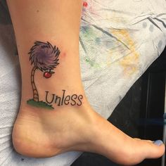 a person with a tattoo on their foot that says unless