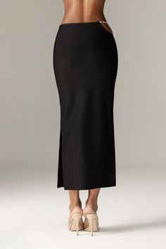 Our 'Star' midi skirt looks so chic paired with our 'Stella' top.It's luxuriously soft bandage in a slim, that hugs your curves in a classic and ultra flattering pencil silhouette, 'Star' has a comfortable flexible waistband that sits low on the natural waist and it has side zipper for easy wear and designed with an open curved side with dangling rhinestone chains for a daring flash of skin. WHERE TO WEAR: Stylish dinner dates, champagne bars, after work drinks, parties. TEAM YOURS WITH: Stella Sleek Party Midi Skirt, Evening Relaxed Fit Midi Skirt, Elegant Fitted Maxi Skirt For Formal Occasions, Elegant Formal Fitted Maxi Skirt, Sleek Midi Skirt, Relaxed Fit Midi Pencil Skirt For Evening, Chic Evening Knee-length Pencil Skirt, Chic Knee-length Evening Pencil Skirt, Elegant Fitted Maxi Skirt With Lining