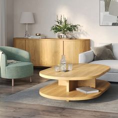 a living room filled with furniture and a wooden table