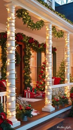 the porch is decked out with christmas decorations and garlands on it's pillars