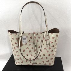 Brand New, Never Used Coach Market Tote Bag With Tags And Original Duster Bag. Chalk Color With Rose Colored Flower. Single Strap Toggle Closure. Perfect Condition, No Scratches Or Marks. Red Flower Tote, Coach Market Tote, Canvas Leather Tote Bag, Animal Print Tote Bags, Plaid Tote, Market Tote Bag, Black Leather Tote Bag, Coach Tote, Colored Flowers