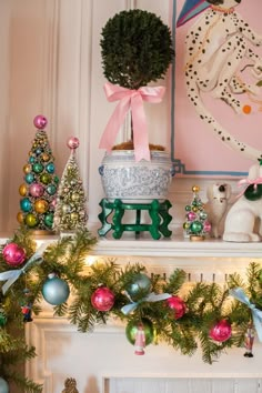 a fireplace mantel decorated for christmas with ornaments and other holiday decorations on the mantle