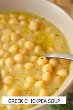 a white bowl filled with chickpeas and garnished with parsley