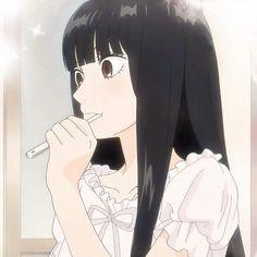 a girl with long black hair brushing her teeth