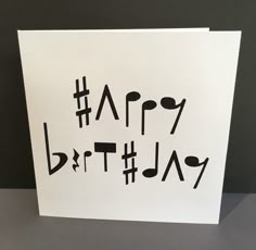 a birthday card with the words happy birthday written in black ink on white cardstock