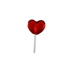 a heart shaped lollipop sitting on top of a stick